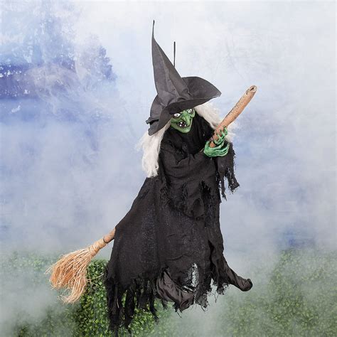 Large airborne witch with broom